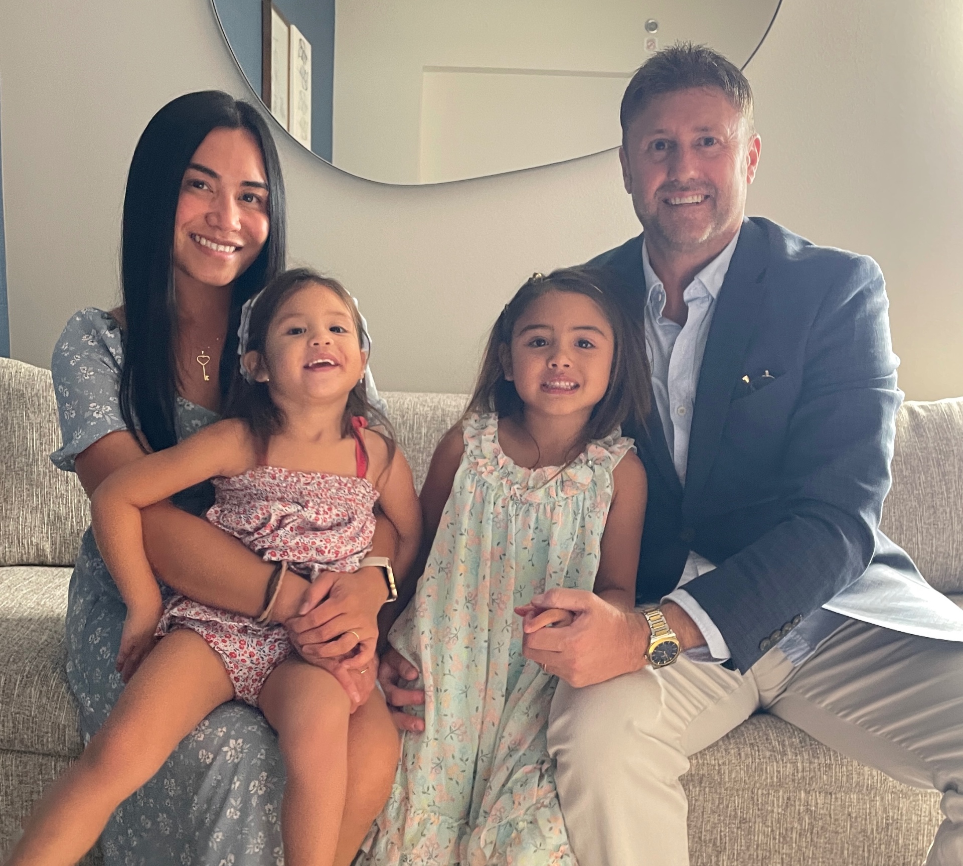 Rhowela A. Friel with her husband and daughters.